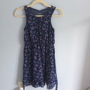 Mid-length Blue dress with feminine, floral pattern that ties in the back